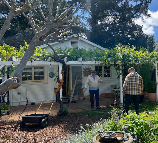 Mendo Labor Co-op crew working on residential property exterior